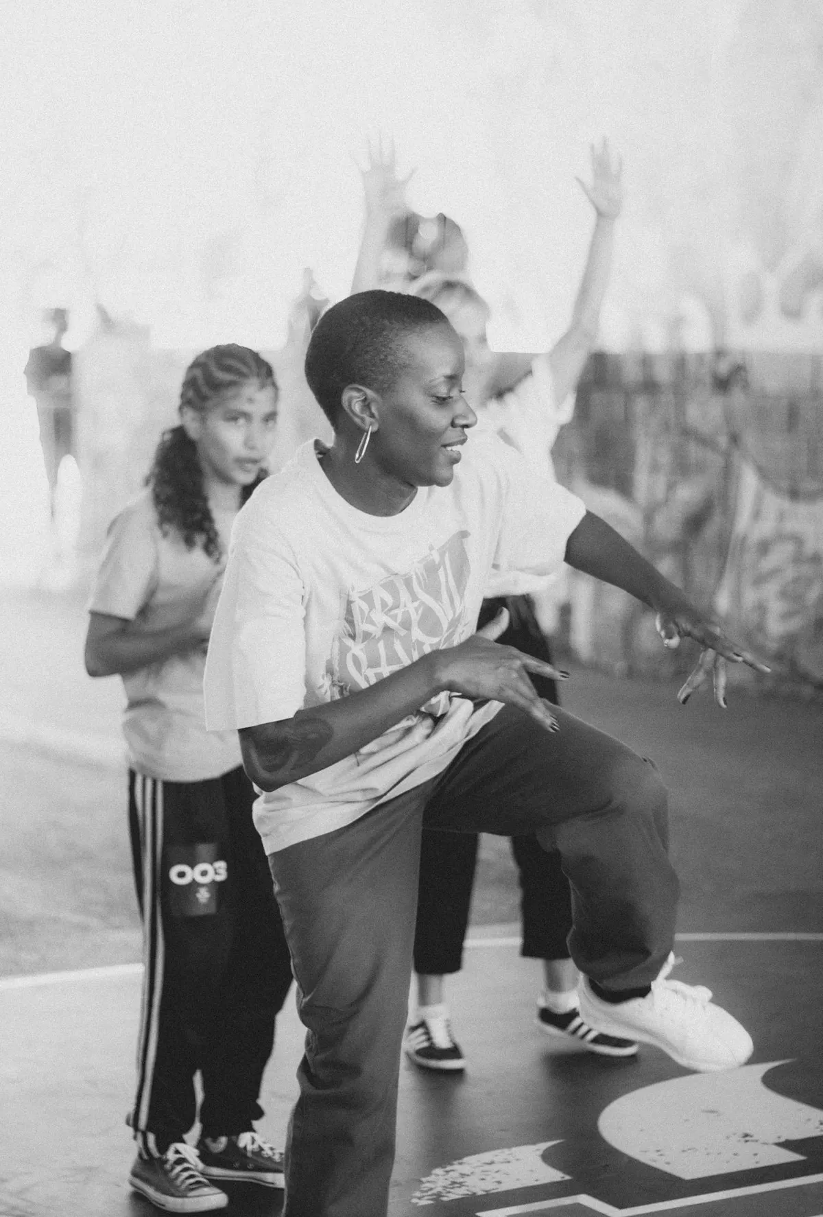 Diverse students in a monochrome street-style dance class